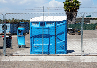 ada portable potty in a work yard